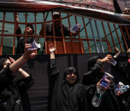 Volunteers distribute water to mourners during a funeral procession for Iran's late Supreme Leader Ayatollah Ali Khamenei, who was killed on February 28 in Israeli and U.S. airstrikes, in Tehran, Iran July 6, 2026. REUTERS/Murad Sezer Foreign media in Iran operate under guidelines set by the Ministry of Culture and Islamic Guidance, which regulates press activity and permissions. ISRAEL OUT. NO COMMERCIAL OR EDITORIAL SALES IN ISRAEL. NO ACCESS FOR ISRAELI MEDIA. NO USE BBC PERSIAN. NO USE VOA PERSIAN. NO USE MANOTO. NO USE IRAN INTERNATIONAL. NO USE RADIO FARDA. DIGITAL: NO USE BBC PERSIAN. NO USE VOA PERSIAN. NO USE MANOTO. NO USE IRAN INTERNATIONAL. NO USE RADIO FARDA.