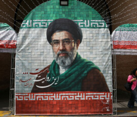 FILE PHOTO: A woman walks next to a banner with a picture of Iran's new Supreme Leader Mojtaba Khamenei in Tehran, Iran, May 8, 2026. Majid Asgaripour/WANA (West Asia News Agency) via REUTERS ATTENTION EDITORS - THIS PICTURE WAS PROVIDED BY A THIRD PARTY/File Photo