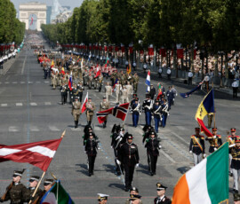 Soldiers from countries of the Coalition of the Willing march during the annual Bastille Day military parade on the Champs-Elysees avenue in Paris, France, July 14, 2026. REUTERS/Benoit Tessier