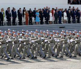 French President Emmanuel Macron, his wife Brigitte Macron, Ukraine's President Volodymyr Zelenskiy and his wife Olena Zelenska, Heads of State and Government of the Coalition of the Willing and members of the French government attend the annual Bastille Day military parade on the Place de la Concorde in Paris, France, July 14, 2026. REUTERS/Tom Nicholson