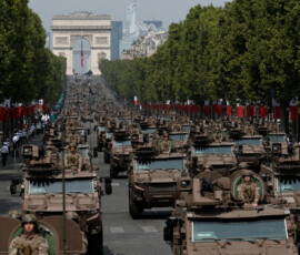 Vehicles of the French 9th Marine Infantry Brigade drive down the Champs-Elysees avenue during the annual Bastille Day military parade in Paris, France, July 14, 2026. REUTERS/Benoit Tessier