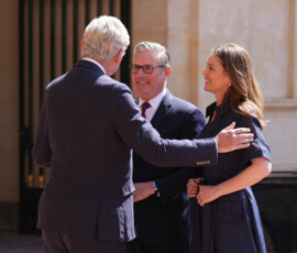 Clive Alderton, Principal Private Secretary to the King and Queen, greets outgoing Prime Minister Keir Starmer and his and his wife Victoria Starmer as he arrives at Buckingham Palace, London, for an audience with King Charles, where he will formally resign as Prime Minister after losing the Labour leadership contest to Andy Burnham, who will become the new Prime Minister. Picture date: Monday July 20, 2026. Aaron Chown/Pool via REUTERS