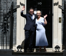 Britain's newly appointed Prime Minister Andy Burnham waves outside 10 Downing Street with his wife Marie-France van Heel after taking office, in London, Britain, July 20, 2026. REUTERS/Isabel Infantes
