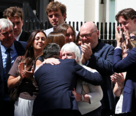 Britain's newly appointed Prime Minister Andy Burnham, hugs his mother Eileen Burnham, as he arrives at 10 Downing Street on his first day in office, in London, Britain, July 20, 2026. REUTERS/Kevin Coombs