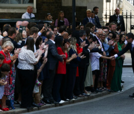 Britain's newly appointed Prime Minister Andy Burnham and his wife Marie-France van Heel greet supporters as they arrive at 10 Downing Street for Burnham's first day in office, in London, Britain, July 20, 2026. REUTERS/Temilade Adelaja