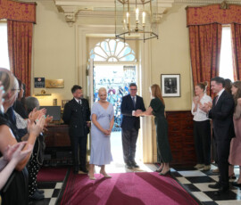 Staff clap as new Prime Minister Andy Burnham and wife Marie-France van Heel walk into 10 Downing Street in London, Monday, July 20, 2026. Kin Cheung/Pool via REUTERS