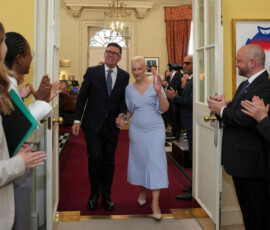 Staff clap as new Prime Minister Andy Burnham and wife Marie-France van Heel walk into 10 Downing Street in London, Monday, July 20, 2026. Kin Cheung/Pool via REUTERS