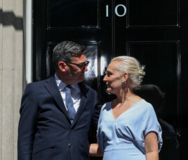 Britain's newly appointed Prime Minister Andy Burnham stands outside 10 Downing Street with his wife Marie-France van Heel after taking office, in London, Britain, July 20, 2026. REUTERS/Isabel Infantes